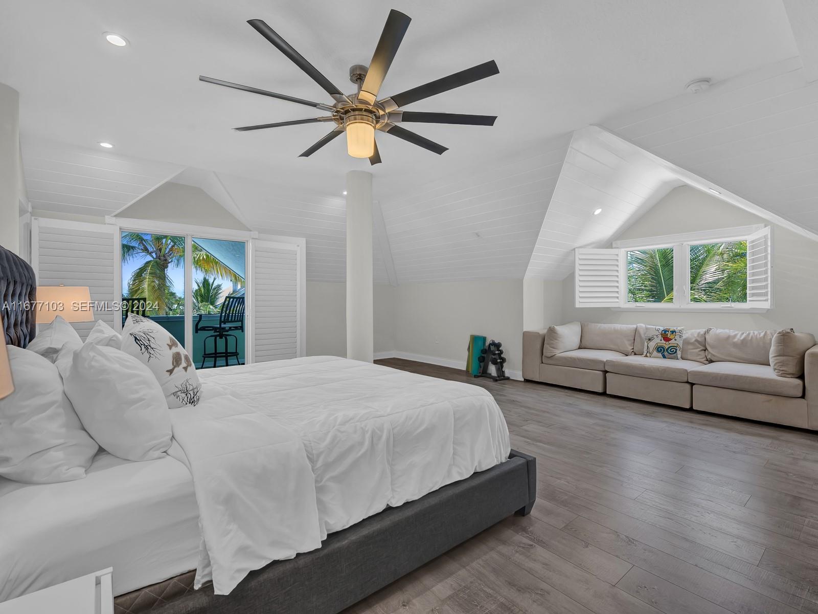 3 North Drive Key Largo, FL 33037 - Photo 38 of 54 a bedroom with a large bed and a large window