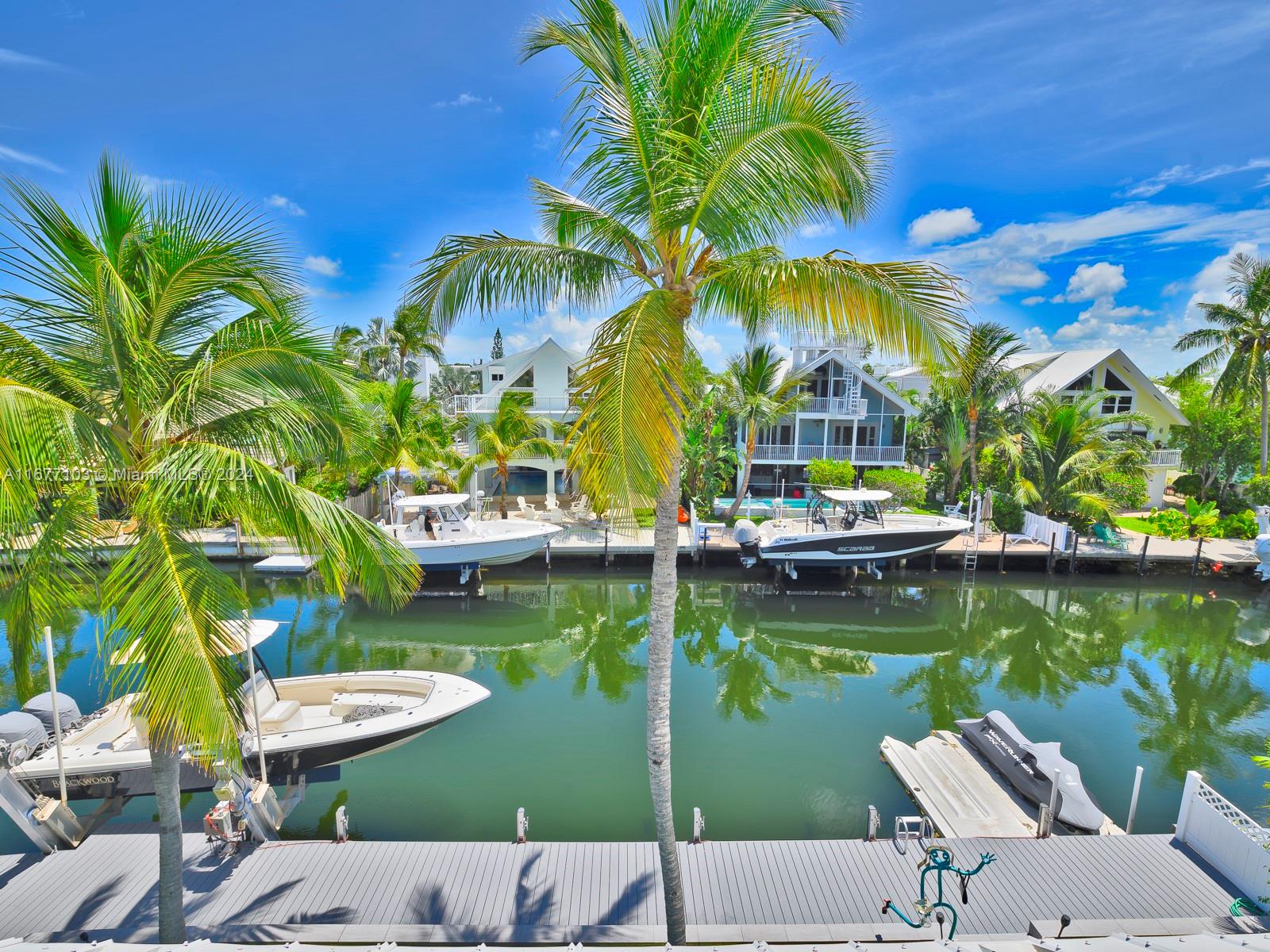 3 North Drive Key Largo, FL 33037 - Photo 40 of 54 a view of swimming pool with outdoor seating and plants
