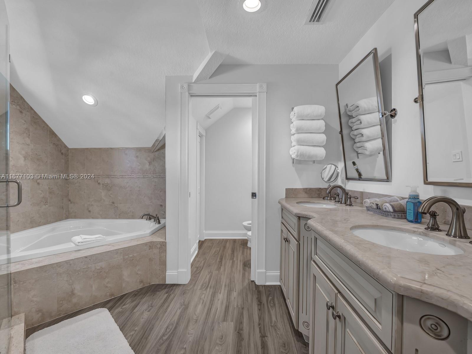 3 North Drive Key Largo, FL 33037 - Photo 42 of 54 a bathroom with a granite countertop sink a toilet and bathtub