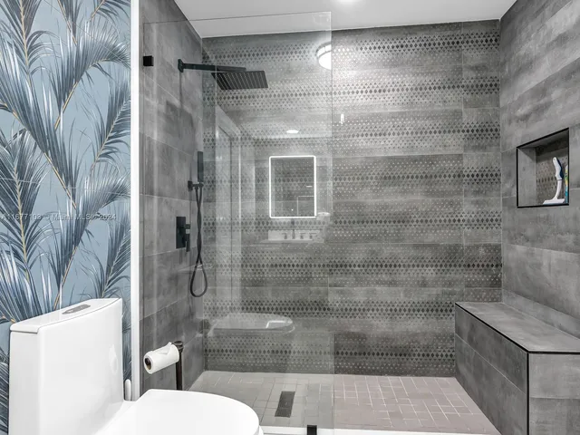 a view of a deck with barbeque grill wooden floor and bench