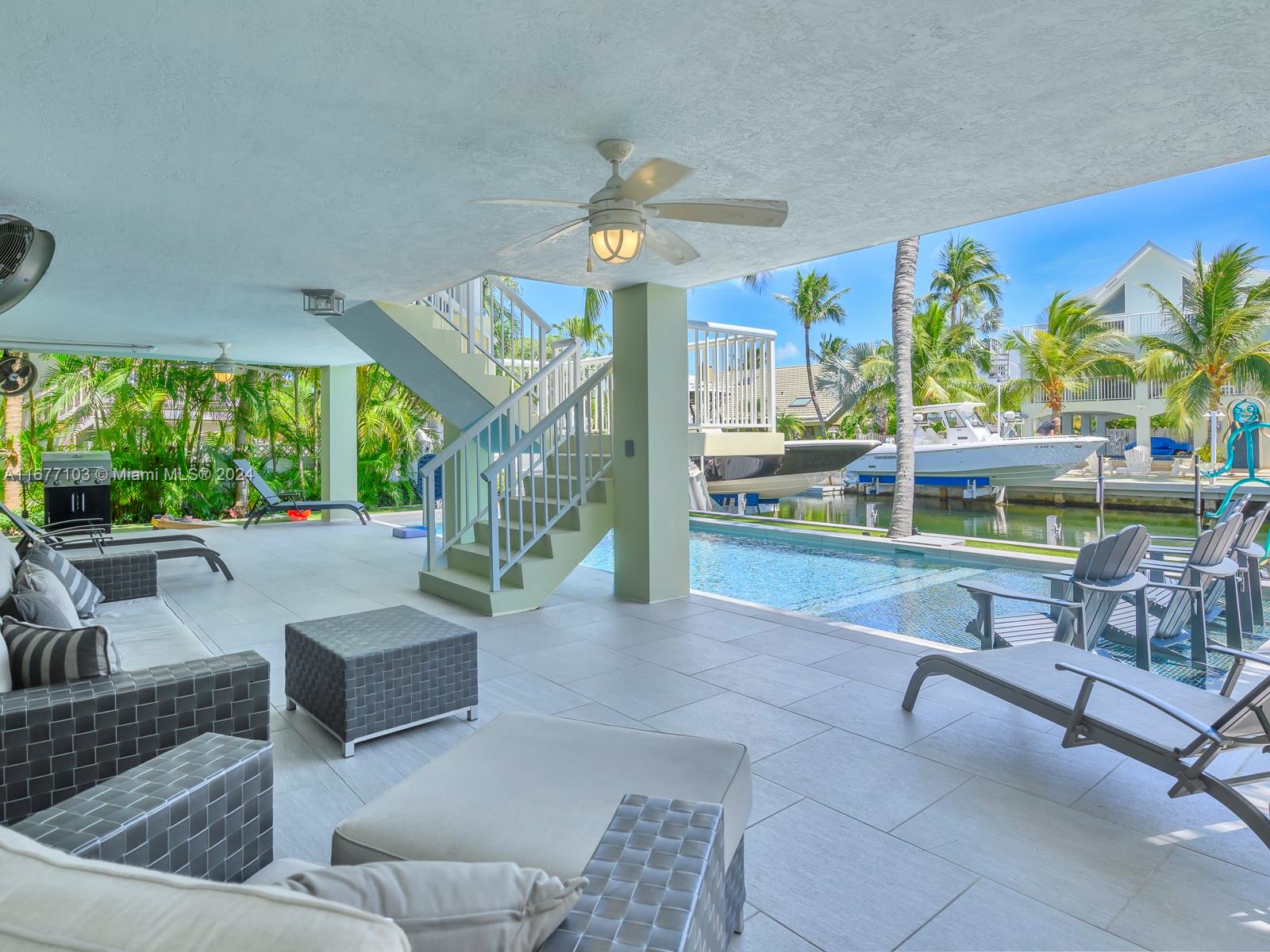 3 North Drive Key Largo, FL 33037 - Photo 48 of 54 a living room with couches and a large window with outer view