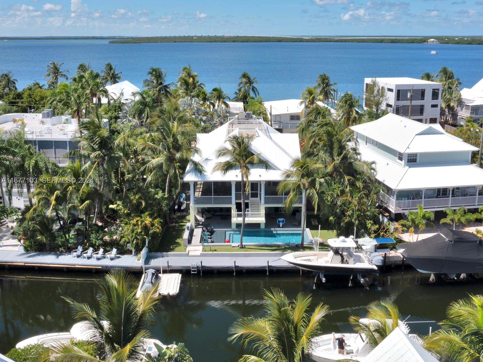 3 North Drive Key Largo, FL 33037 - Photo 5 of 54 a view of swimming pool with outdoor seating and lake view