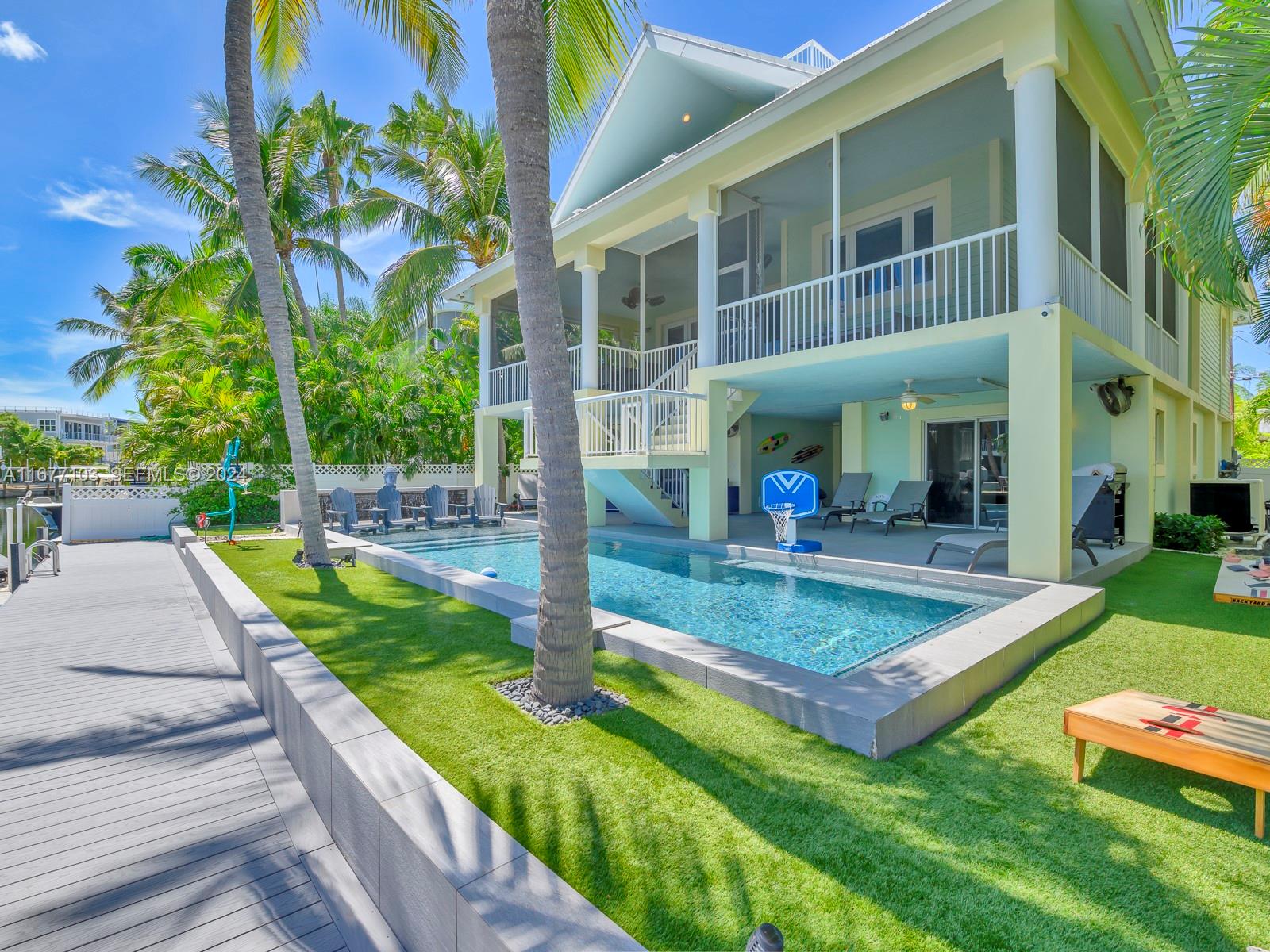 3 North Drive Key Largo, FL 33037 - Photo 51 of 54 a view of a house with swimming pool and sitting area