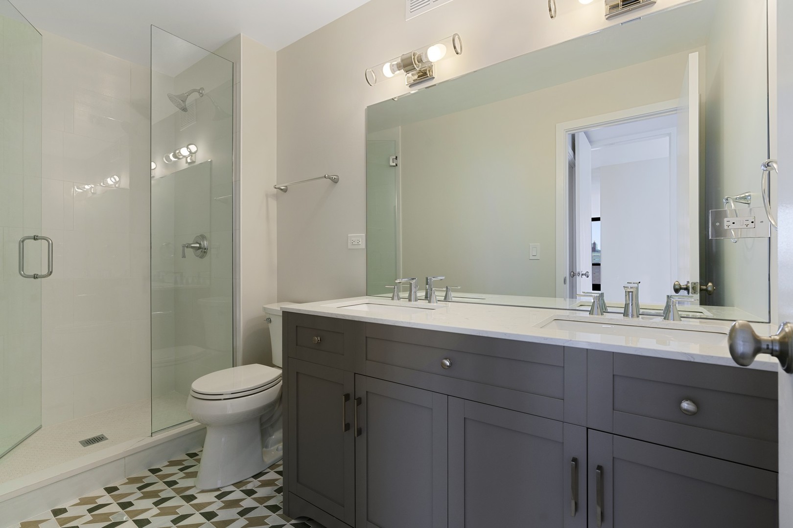 1030 North State Street, Unit 13E Chicago, IL 60610 - Photo 14 of 30 a bathroom with a sink a toilet and shower