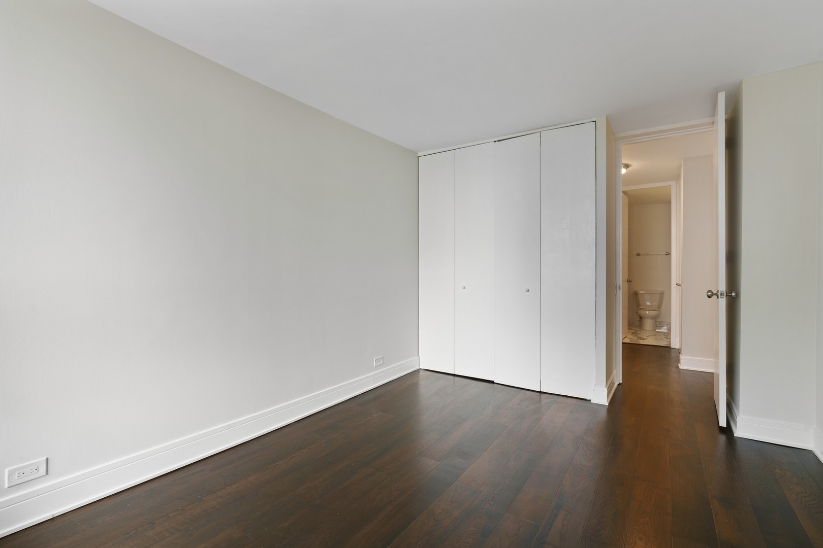 1030 North State Street, Unit 13E Chicago, IL 60610 - Photo 17 of 30 a view of an empty room with wooden floor