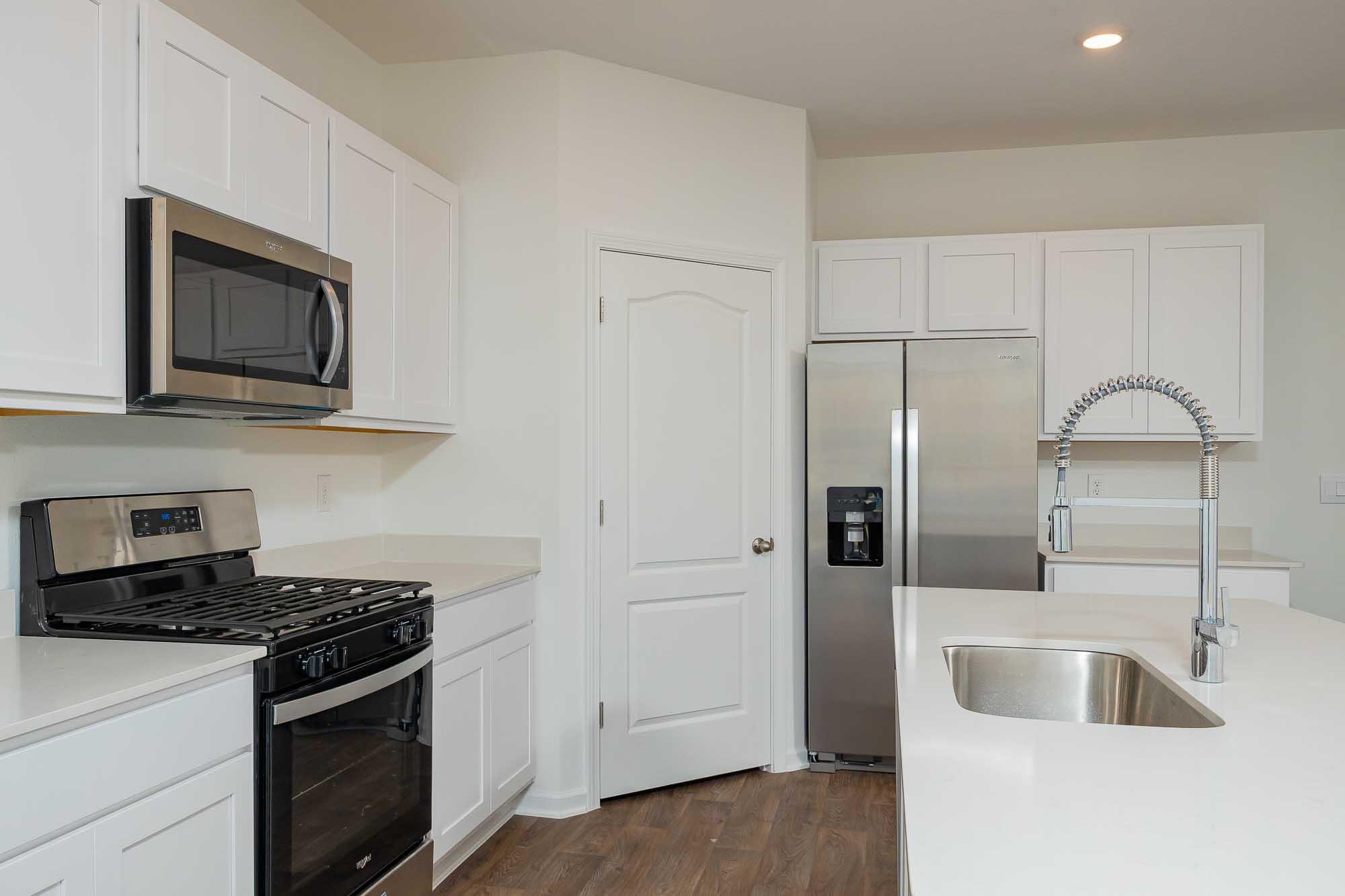951 Orellana Road St. Augustine, FL 32084 - Photo 15 of 54 a kitchen with stainless steel appliances granite countertop a sink stove and refrigerator