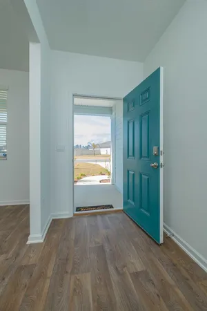 a kitchen with stainless steel appliances granite countertop a refrigerator a sink a stove a microwave and a refrigerator