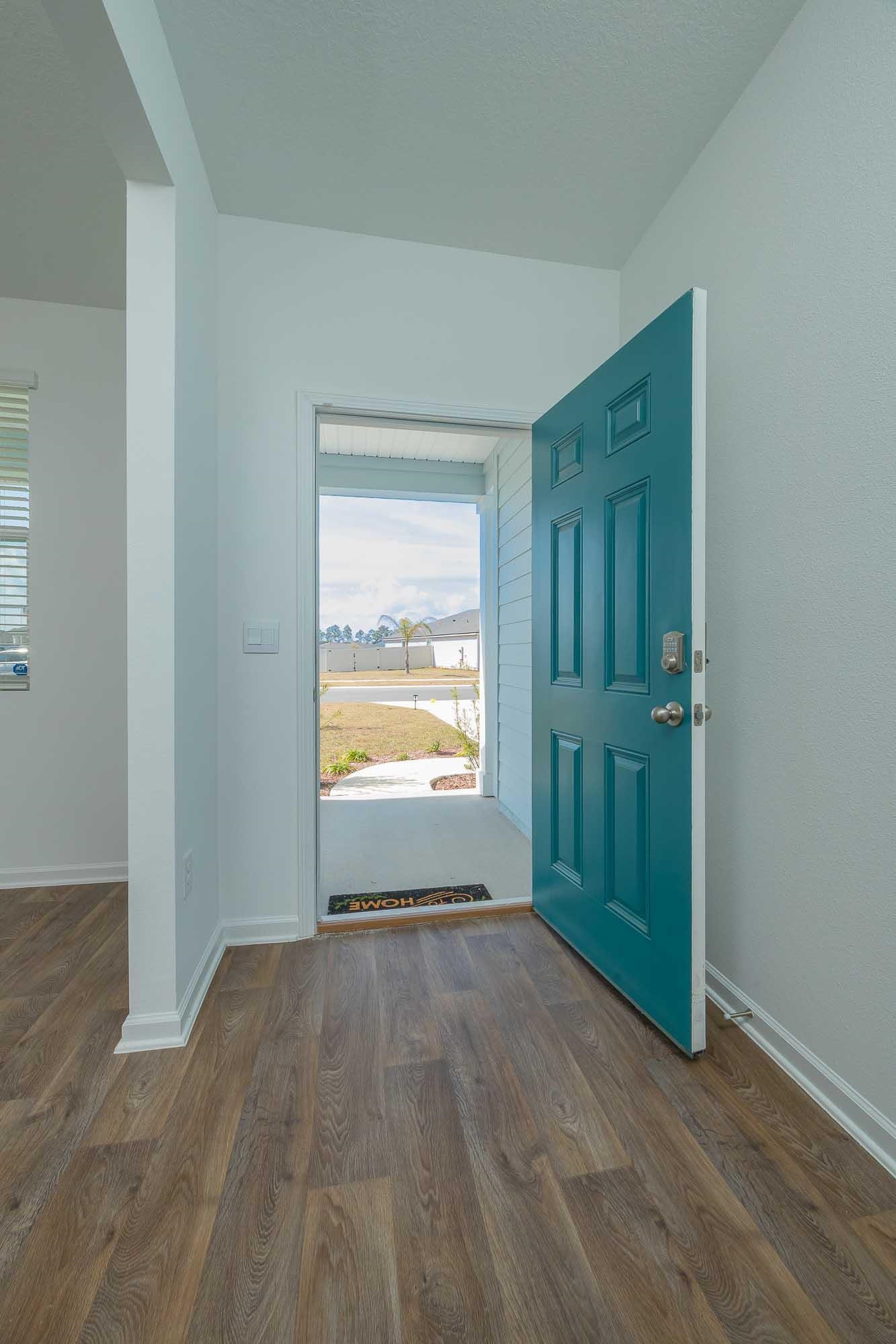 951 Orellana Road St. Augustine, FL 32084 - Photo 29 of 54 an empty room with wooden floor and a window