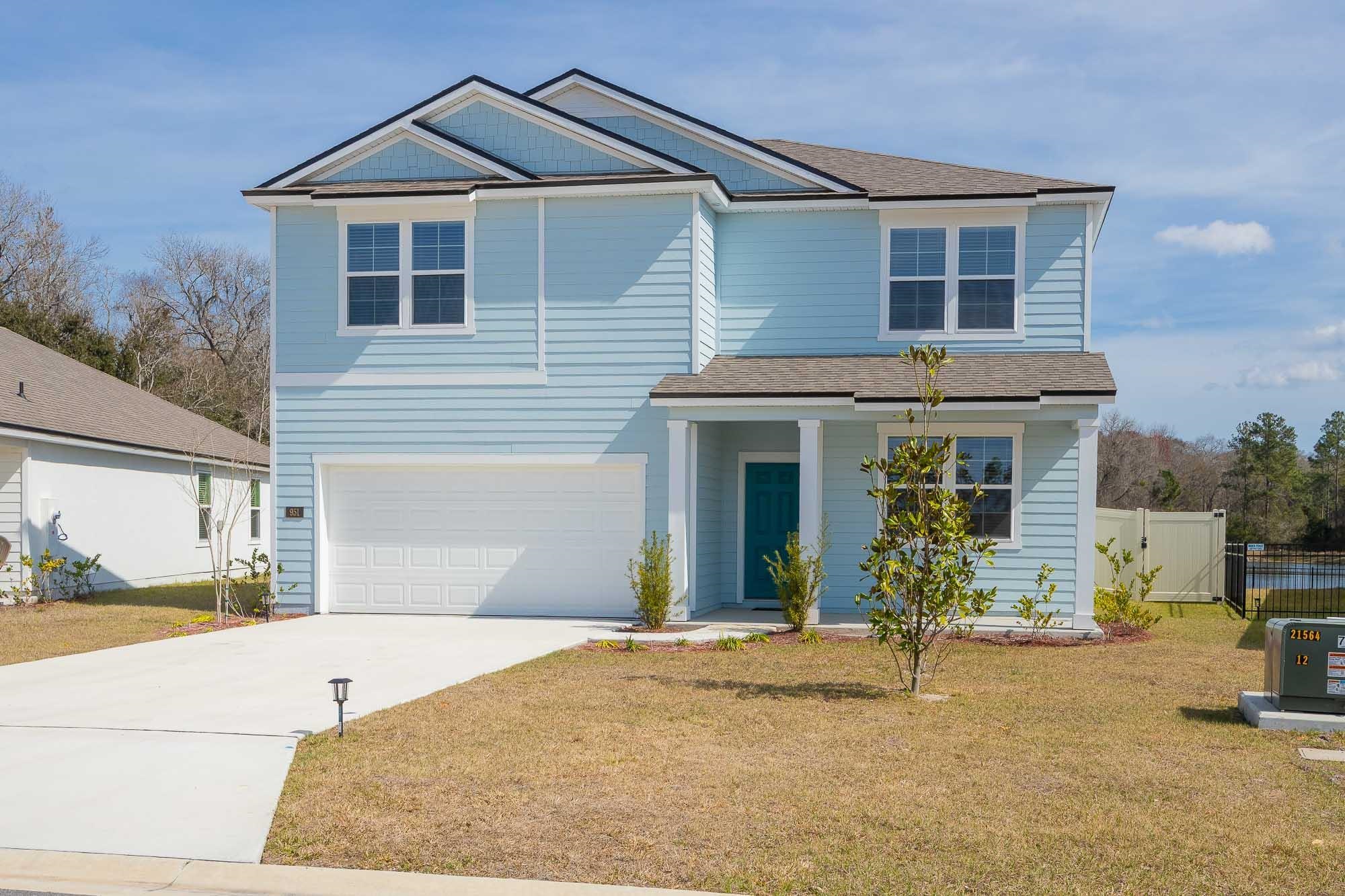 951 Orellana Road St. Augustine, FL 32084 - Photo 3 of 54 a front view of a house with a yard