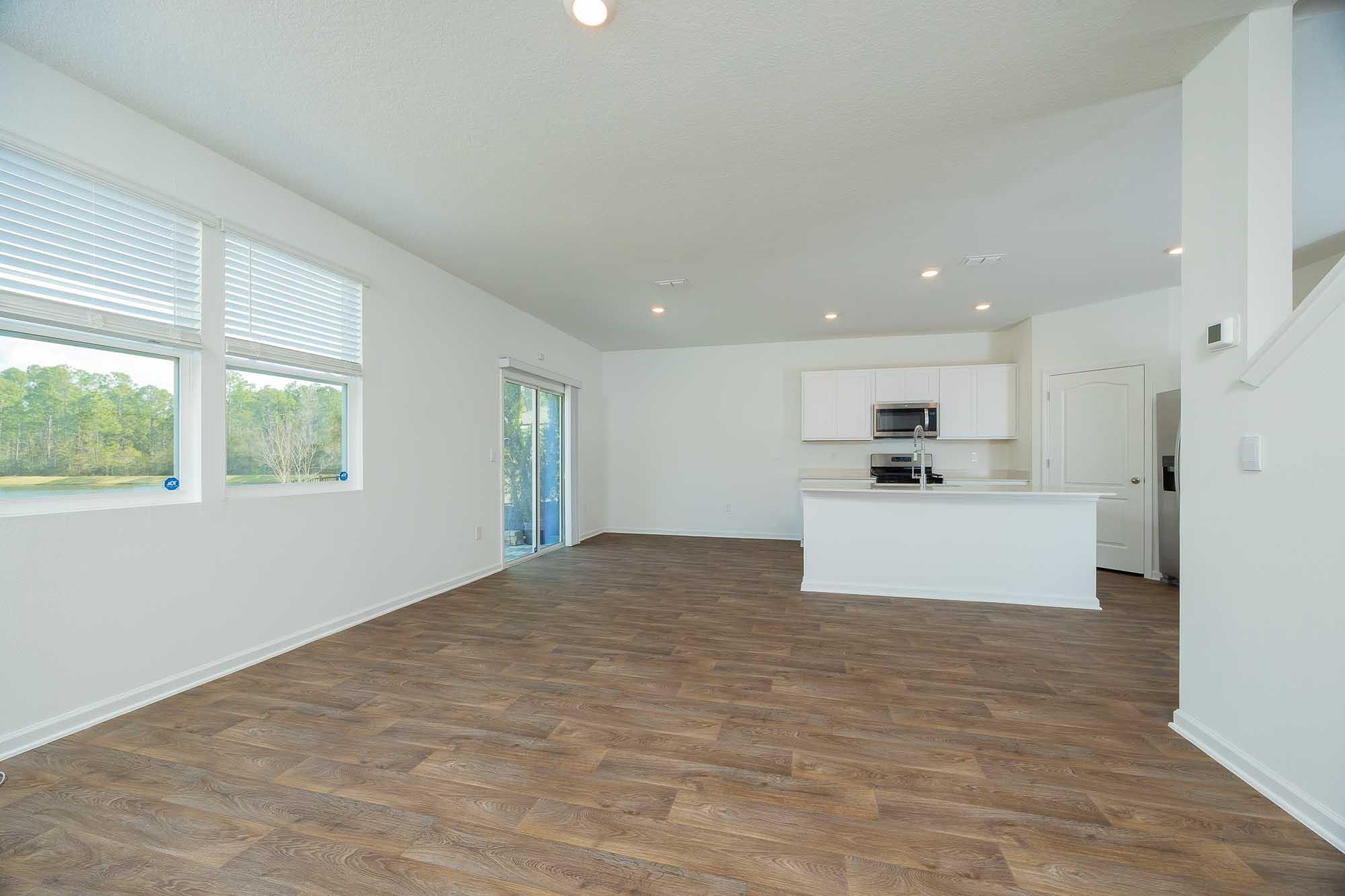 951 Orellana Road St. Augustine, FL 32084 - Photo 39 of 54 a view of kitchen with kitchen island white cabinets and refrigerator