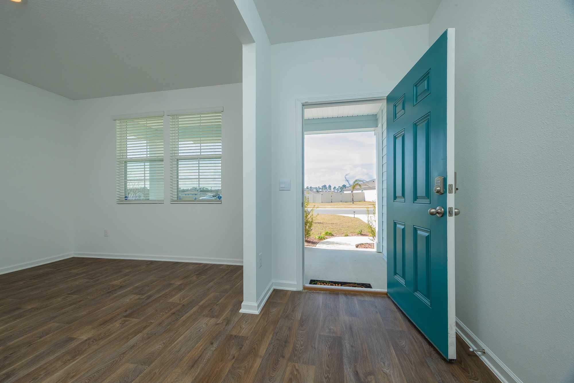 951 Orellana Road St. Augustine, FL 32084 - Photo 4 of 54 an empty room with wooden floor and a window