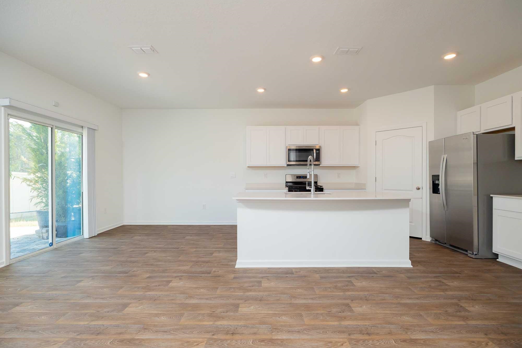 951 Orellana Road St. Augustine, FL 32084 - Photo 7 of 54 a view living room with stainless steel appliances wooden floor and window