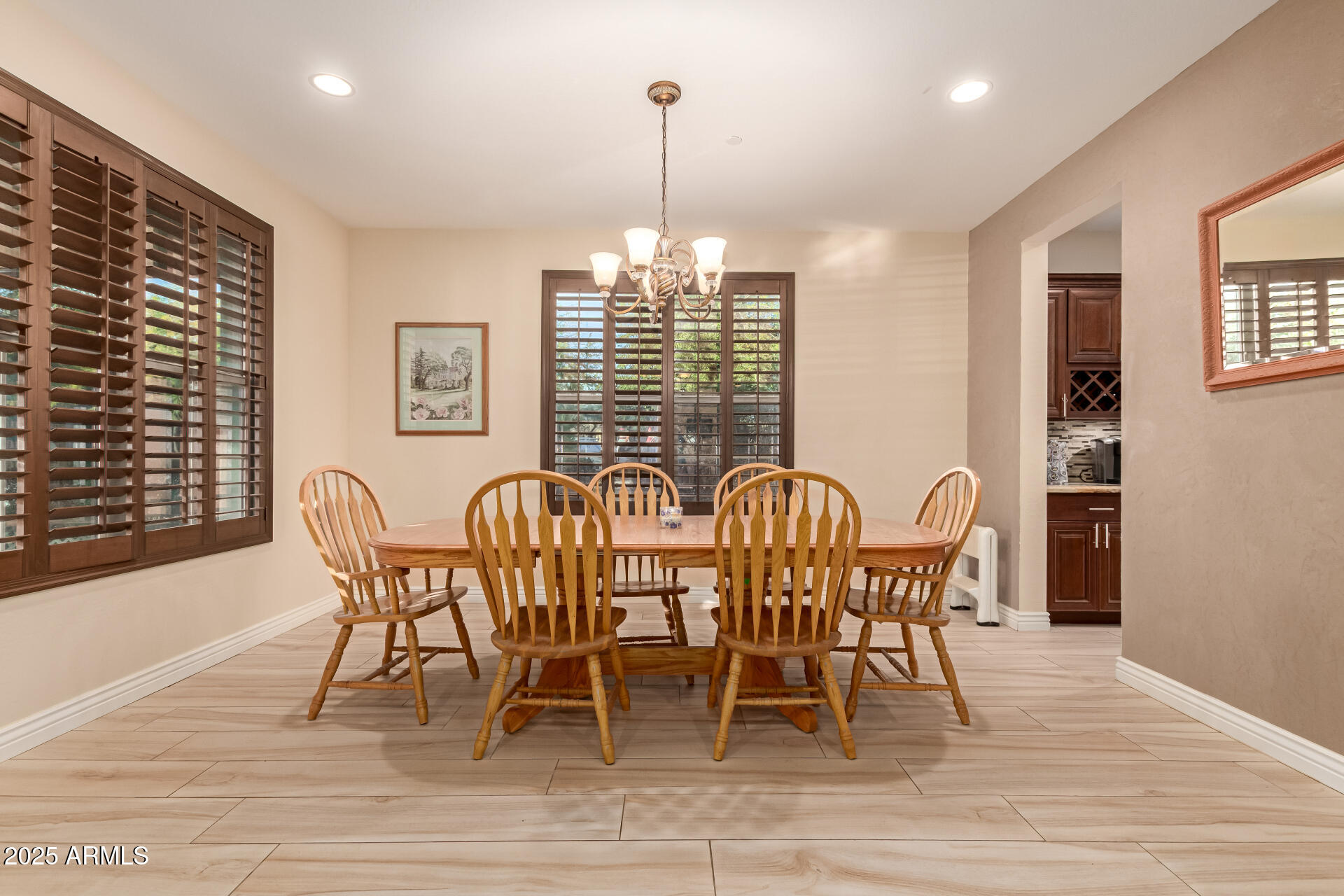 2247 North Beverly Place Buckeye, AZ 85396 - Photo 16 of 95 a view of a dining room with furniture window and wooden floor