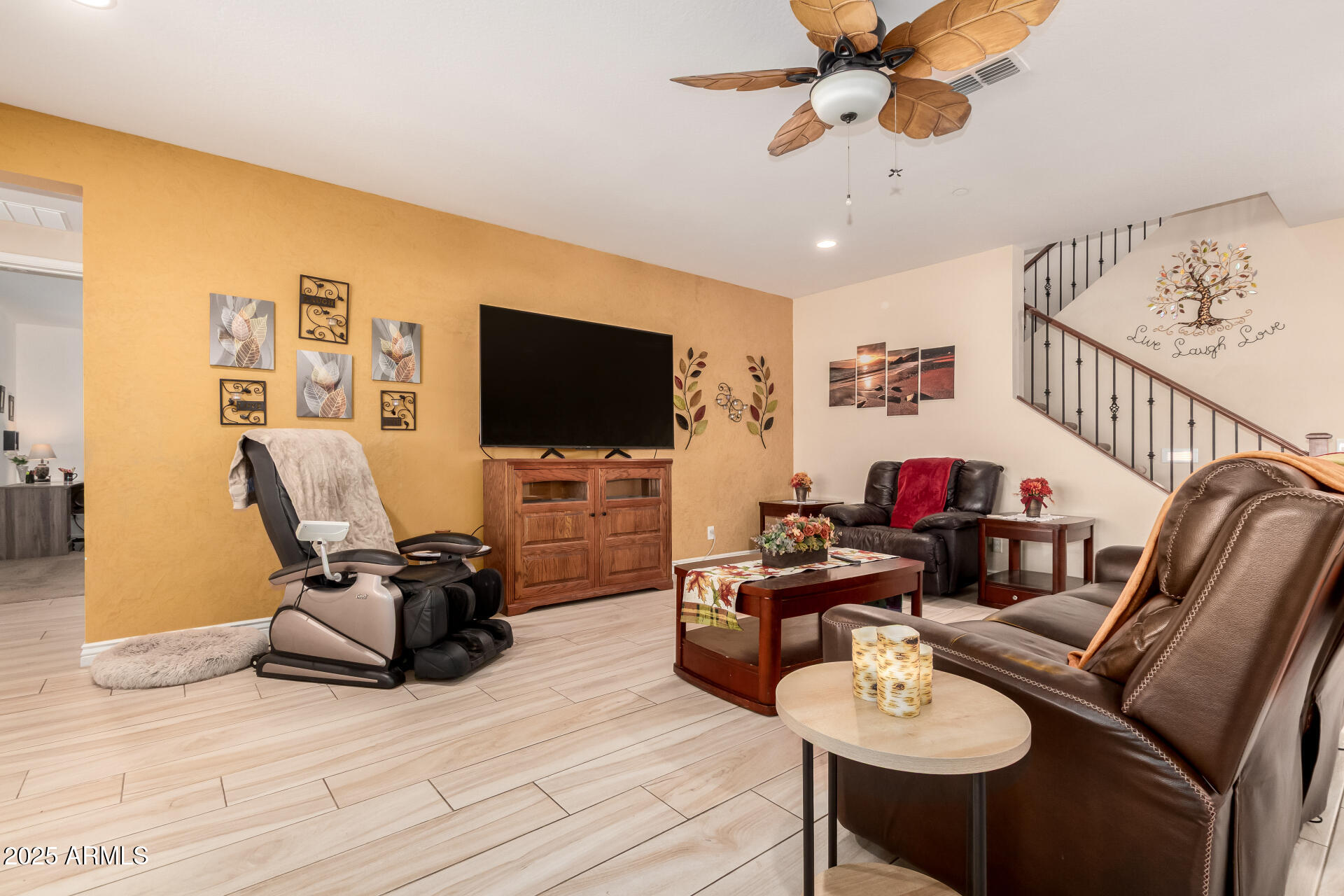 2247 North Beverly Place Buckeye, AZ 85396 - Photo 10 of 95 a living room with furniture and a flat screen tv