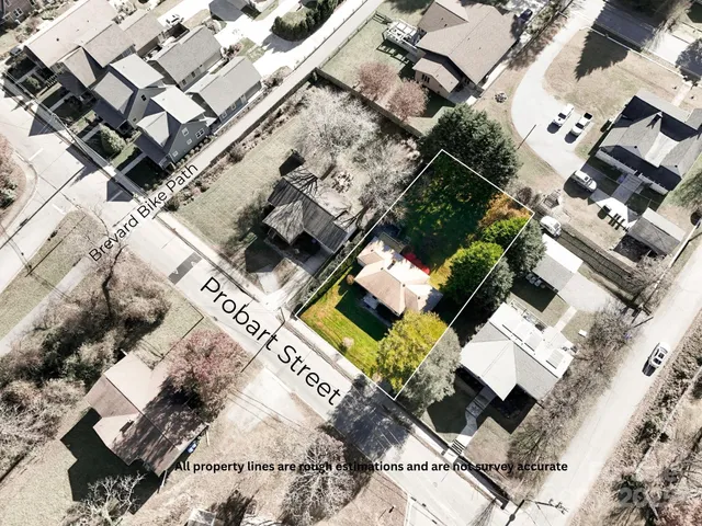 an aerial view of a house with a garden