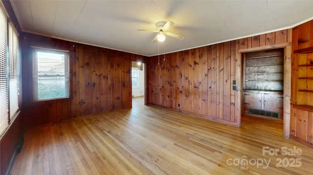 a view of livingroom with hardwood floor and hallway