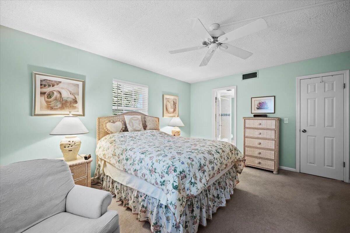 1252 Sugar Sands Boulevard, Unit 137 Riviera Beach, FL 33404 - Photo 21 of 38 a bedroom with bed and window