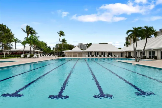 a view of swimming pool with outdoor seating and plants