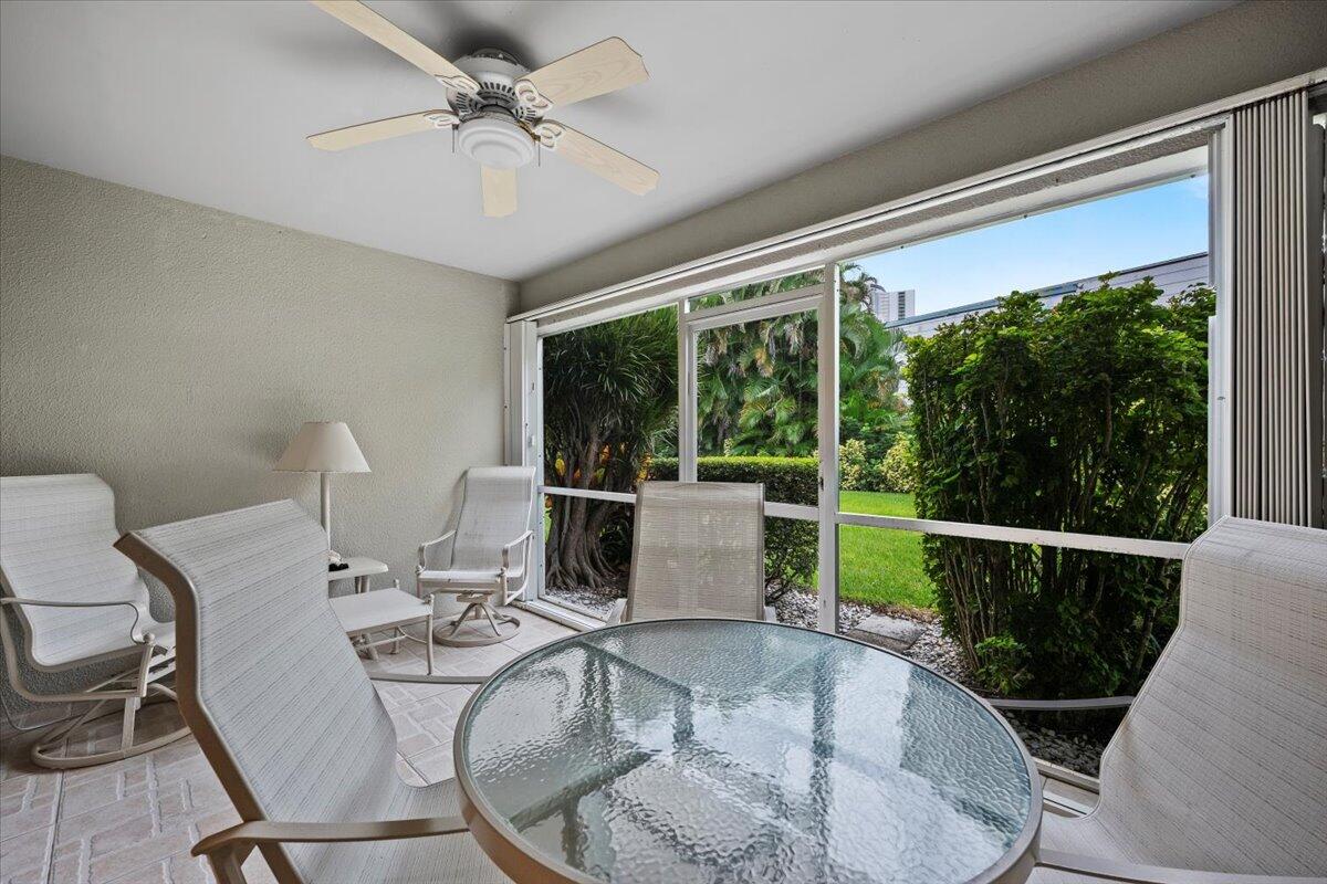 1252 Sugar Sands Boulevard, Unit 137 Riviera Beach, FL 33404 - Photo 7 of 38 a view of a dining room with furniture wooden floor and chandelier
