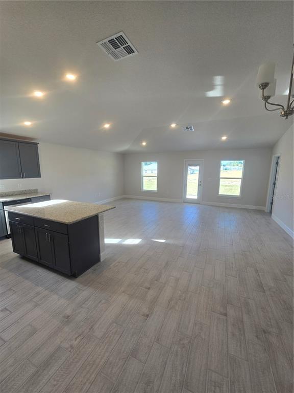 423 Wood Stork Trail Inverness, FL 34453 - Photo 11 of 19 a spacious bathroom with a sink and a mirror