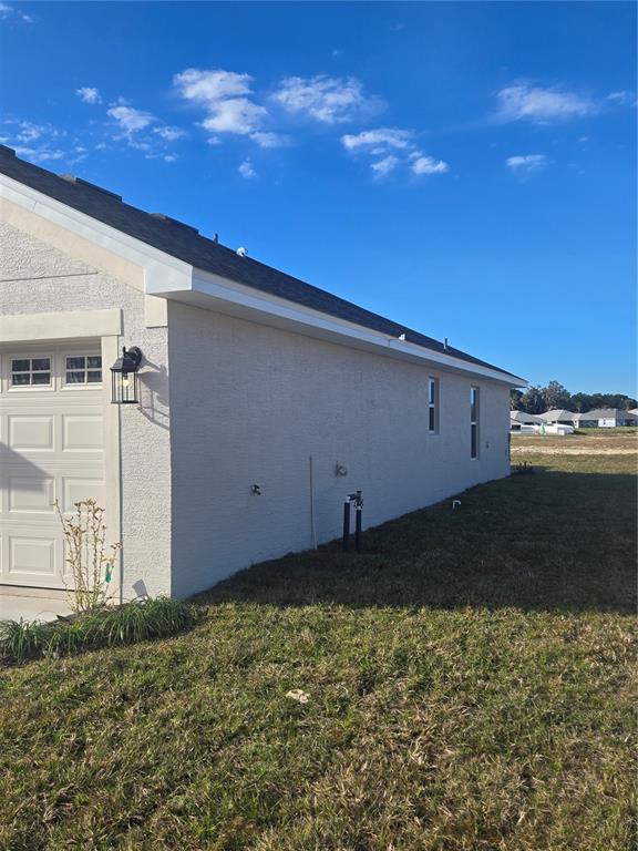 423 Wood Stork Trail Inverness, FL 34453 - Photo 2 of 19 a backyard of a house