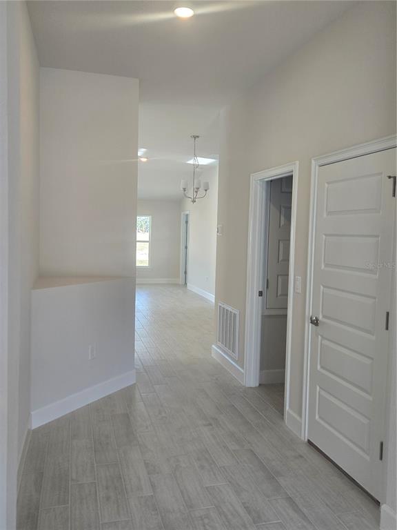 423 Wood Stork Trail Inverness, FL 34453 - Photo 7 of 19 wooden floor in an empty room