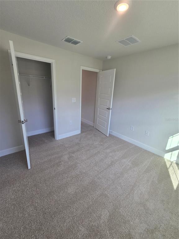 423 Wood Stork Trail Inverness, FL 34453 - Photo 8 of 19 a view of room with walk in closet