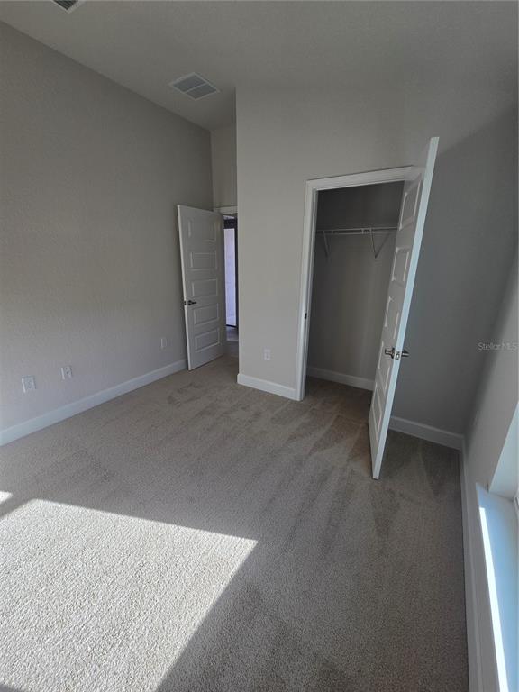 423 Wood Stork Trail Inverness, FL 34453 - Photo 9 of 19 an empty room with a door