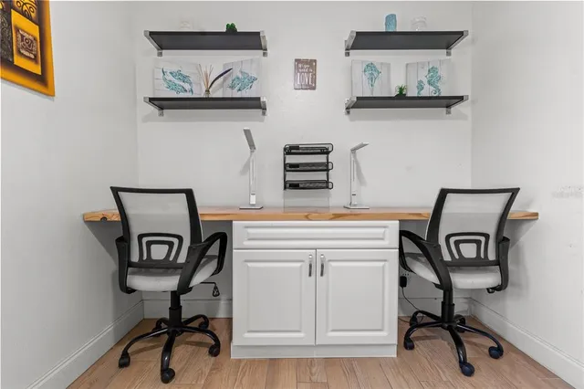 a view of a workspace with furniture