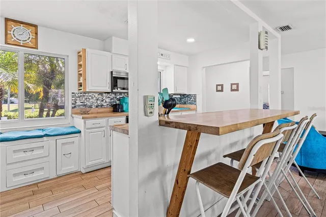 a view of a kitchen and dining room