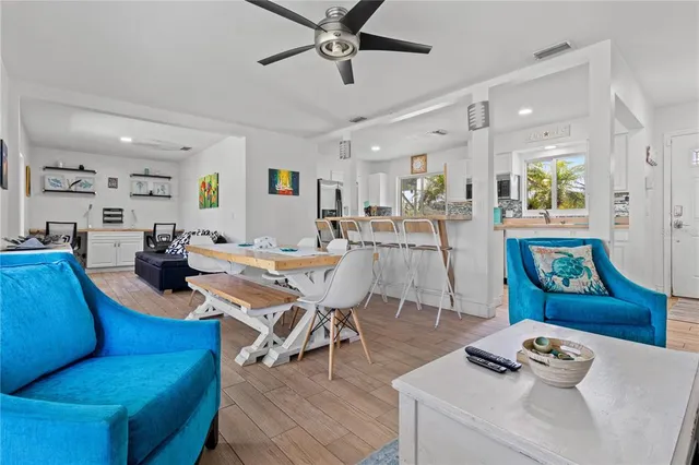 a living room with furniture and a wooden table