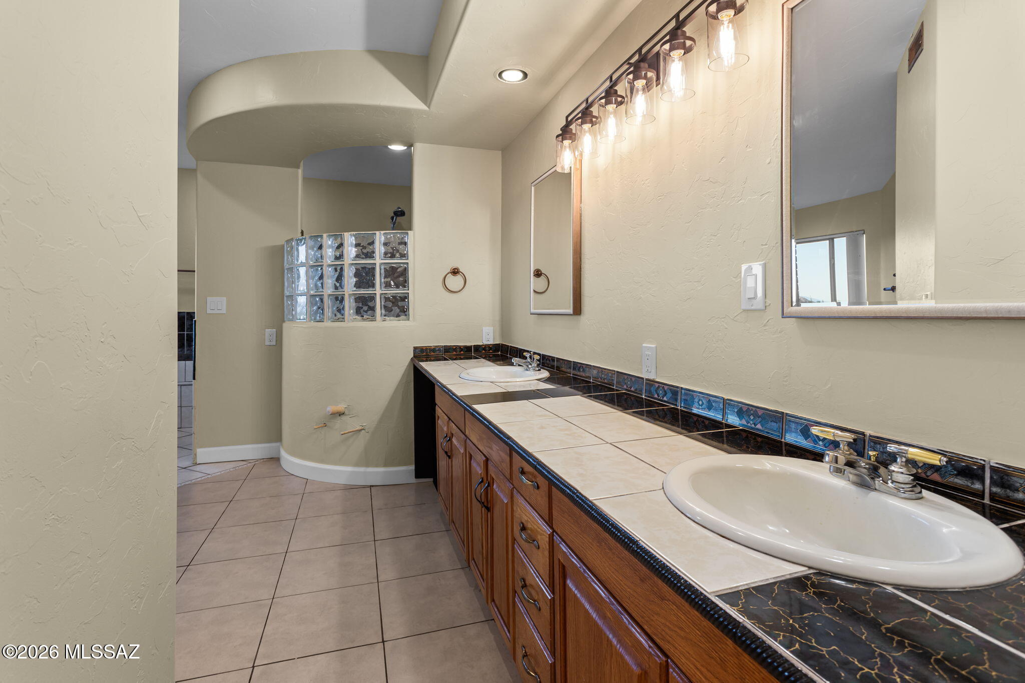 4210 West Mossman Road Tucson, AZ 85746 - Photo 21 of 51 a bathroom with a sink and a mirror