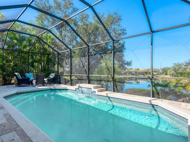 a view of a lake with houses in the back