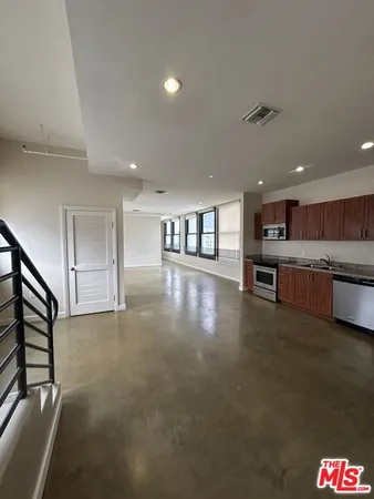 a view of a kitchen with a sink wooden floor and a kitchen view