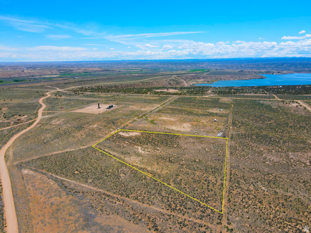 4500 South 22750th Duchesne, UT 84021 - Photo 20 of 34 Expansive undeveloped land featuring a distinct property boundary, natural vegetation, and a distant body of water