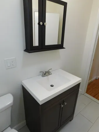 a bathroom with a sink and a toilet