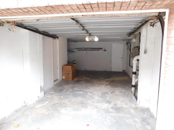 a view of a hallway with stairs