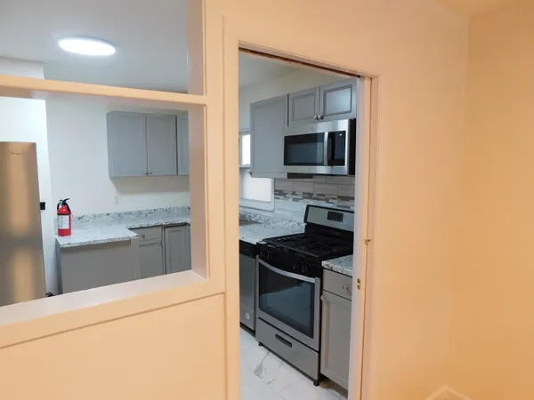 a kitchen with a stove and a microwave