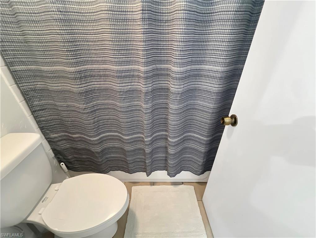 600 Neapolitan Way, Unit 342 Naples, FL 34103 - Photo 13 of 50 a bathroom with a toilet and a sink