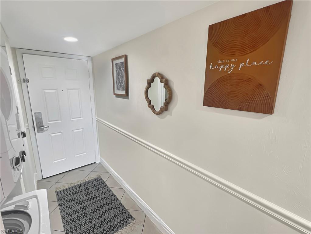 600 Neapolitan Way, Unit 342 Naples, FL 34103 - Photo 2 of 50 a bathroom with a shower and a sink