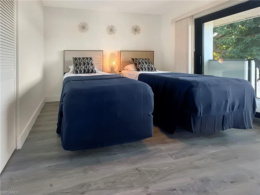 600 Neapolitan Way, Unit 342 Naples, FL 34103 - Photo 23 of 50 a bedroom with a bed and a window