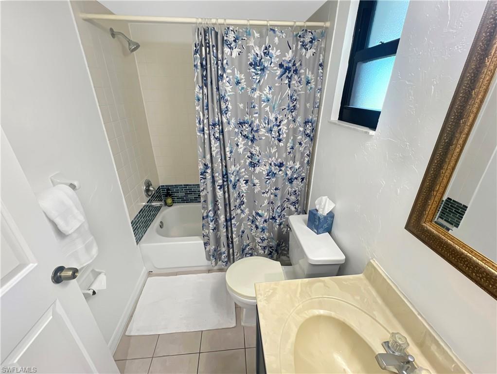 600 Neapolitan Way, Unit 342 Naples, FL 34103 - Photo 25 of 50 a bathroom with a sink toilet and shower