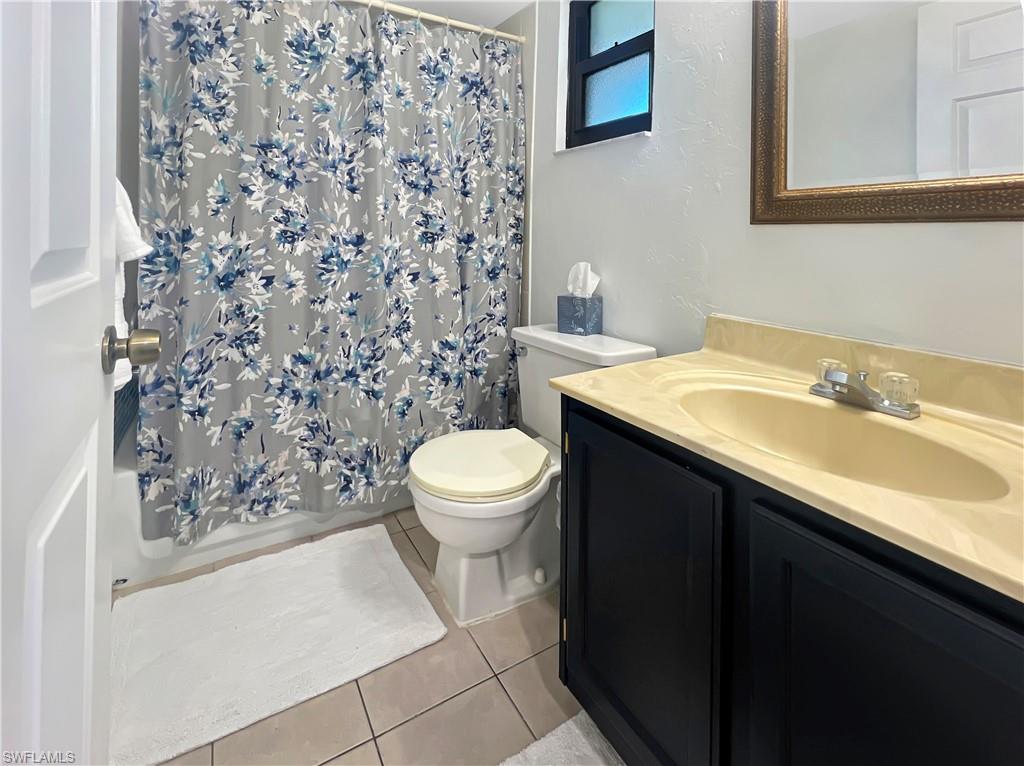 600 Neapolitan Way, Unit 342 Naples, FL 34103 - Photo 26 of 50 a bathroom with a sink toilet and shower