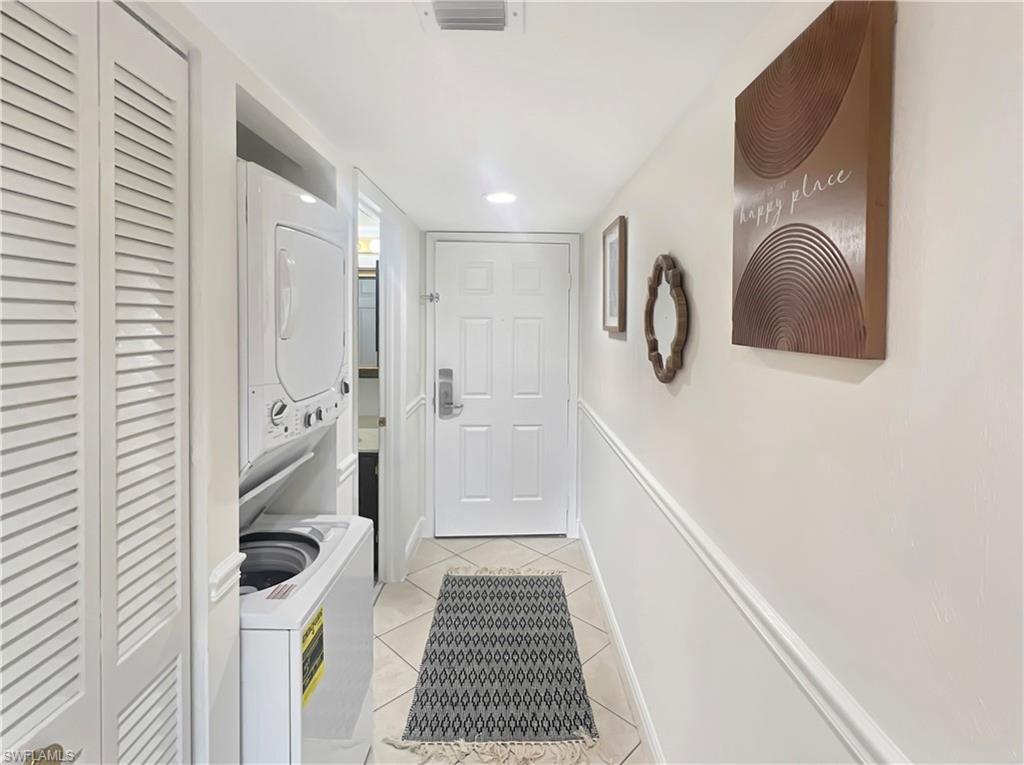 600 Neapolitan Way, Unit 342 Naples, FL 34103 - Photo 30 of 50 a bathroom with a sink and a shower