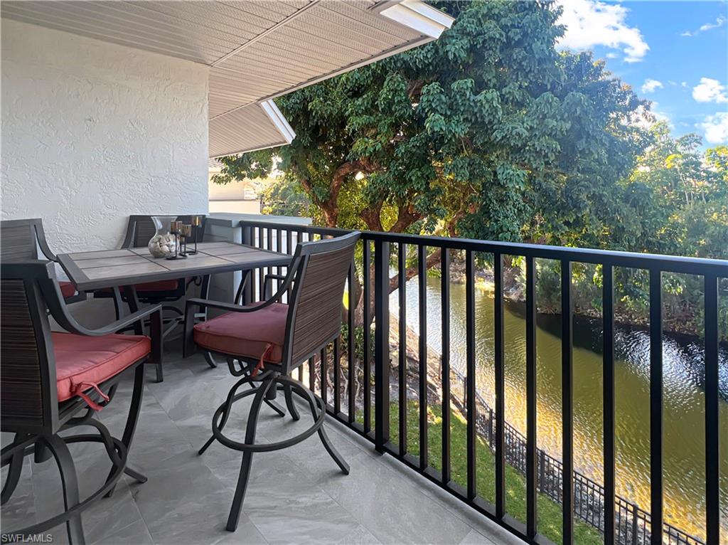 600 Neapolitan Way, Unit 342 Naples, FL 34103 - Photo 31 of 50 a view of a balcony with chairs
