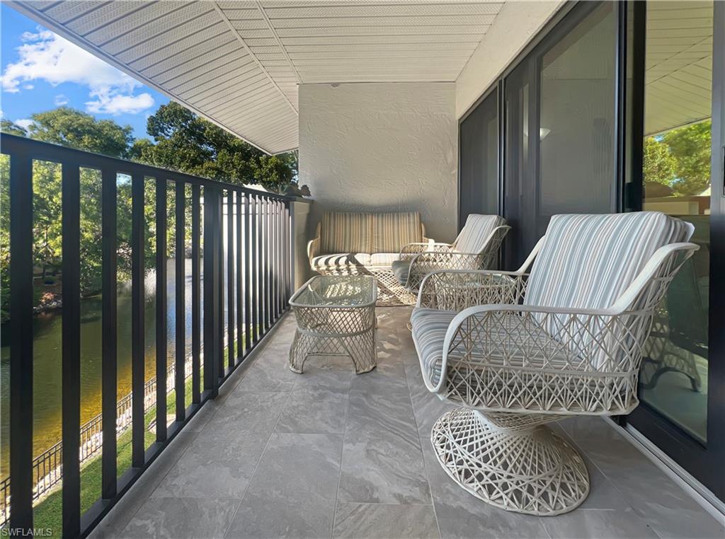 600 Neapolitan Way, Unit 342 Naples, FL 34103 - Photo 33 of 50 a view of balcony with furniture