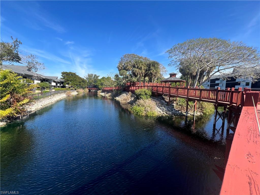 600 Neapolitan Way, Unit 342 Naples, FL 34103 - Photo 39 of 50 a view of a lake with a mountain