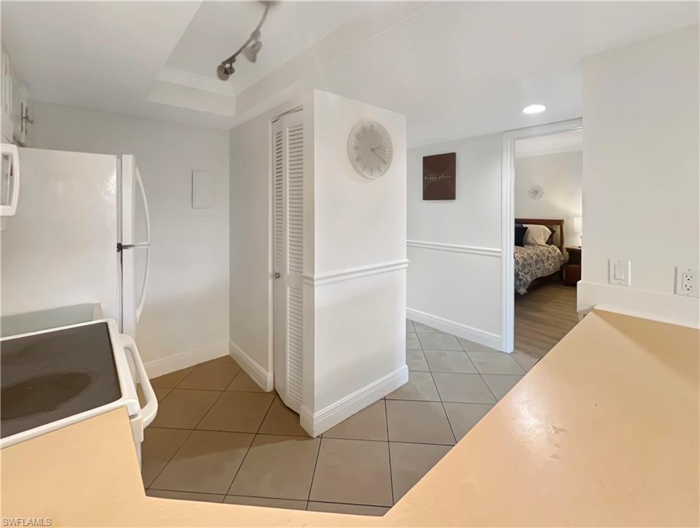 600 Neapolitan Way, Unit 342 Naples, FL 34103 - Photo 7 of 50 a view of a livingroom with wooden floor