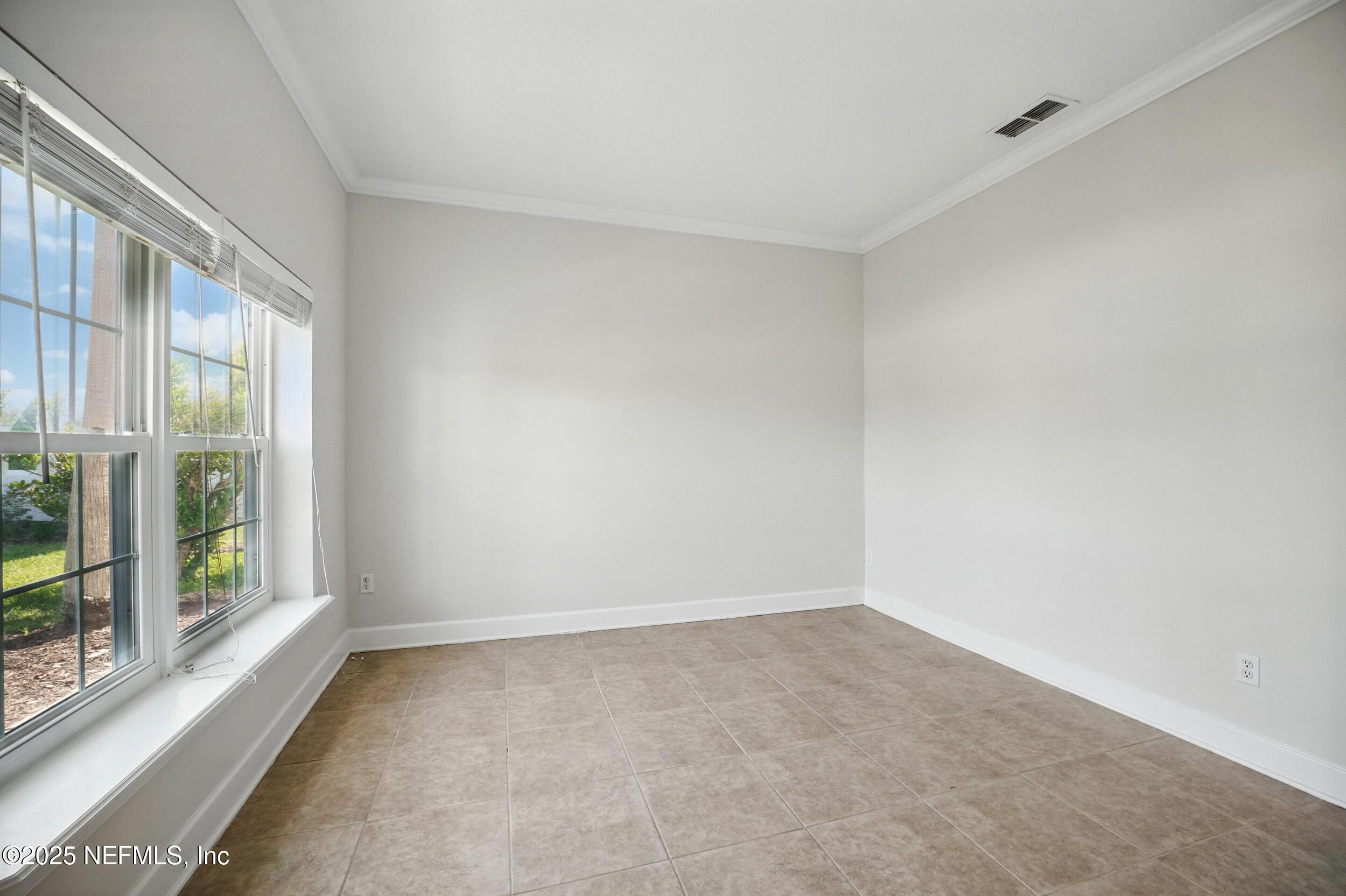 105 2nd Street St. Augustine, FL 32084 - Photo 11 of 61 a view of an empty room with a window