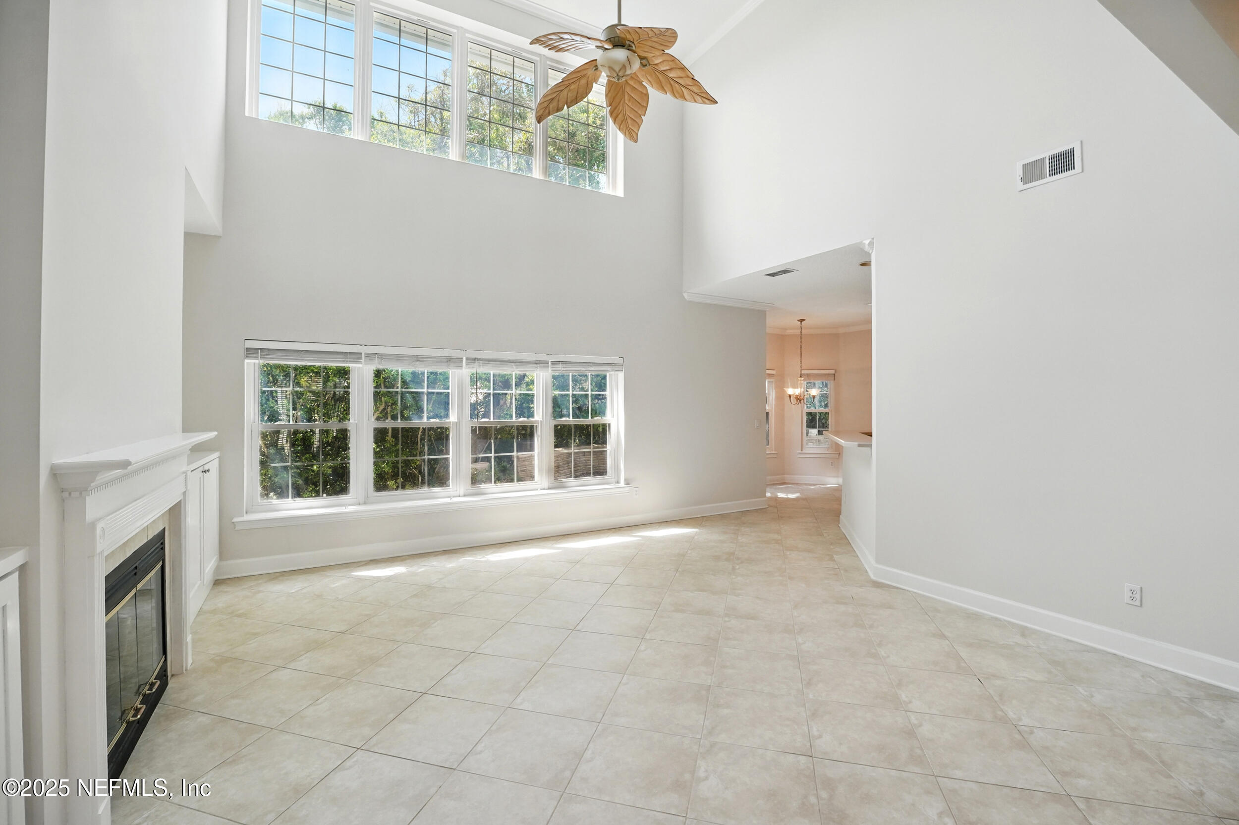 105 2nd Street St. Augustine, FL 32084 - Photo 14 of 61 a view of an empty room with a fireplace and a window